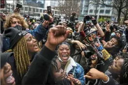  ?? Chandan Khanna/AFP via Getty Images ?? People celebrate as the verdict is announced Tuesday in the trial of former police officer Derek Chauvin outside the Hennepin County Government Center in Minneapoli­s, Minn.