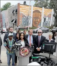  ?? AP/STEVE RUARK ?? “We do not believe Freddie Gray killed himself,” Baltimore State’s Attorney Marilyn Mosby said Wednesday at a news conference near the site where Gray, depicted in the mural in the background, was arrested in April 2015.