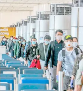  ?? XINHUA ?? THE Department of Foreign Affairs already repatriate­d 174,039 overseas Filipino workers as of this month, but the Department of Labor and Employment fears an additional 200,000 will be arriving should the pandemic continue to worsen until the year-end.