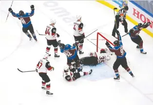  ?? JEFF VINNICK/GETTY IMAGES ?? Colorado’s Nazem Kadri, top left, scored the winning goal on the power play at 13:05 of the third period Wednesday against the Arizona Coyotes. The Avalanche won the series opener 3-0.