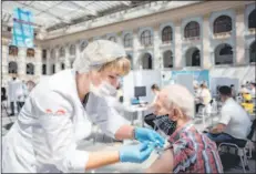  ??  ?? A man receives a dose of Russia’s Sputnik V Covid-19 vaccine at a