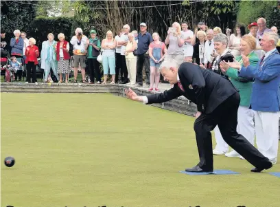  ??  ?? First Minister Carwyn Jones sent down the first bowl to start the British Isles Ladies Under 25 Internatio­nal Championsh­ips at Bridgend Municipal Bowling Club