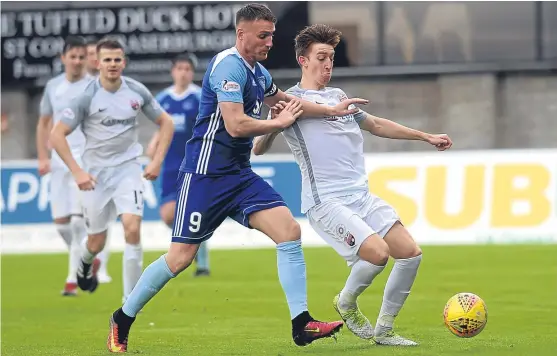  ?? Picture: Heather Fowlie. ?? Matty Allan, right, in action against Peterhead’s Rory McAllister at Balmoor Stadium.