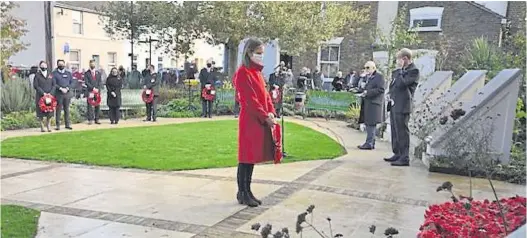  ??  ?? Faversham MP Helen Whately lays a wreath at the town’s service; right, Chartham Royal British Legion standard bearer Paul Austen at the village Remembranc­e Service