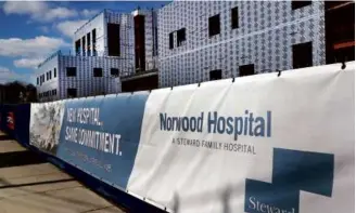  ?? JOHN TLUMACKI/GLOBE STAFF ?? Norwood Hospital, operated by Steward Health Care, was damaged by a flash flood in 2020. The facility is still under constructi­on but the completion has been delayed by a battle over rebuilding costs.