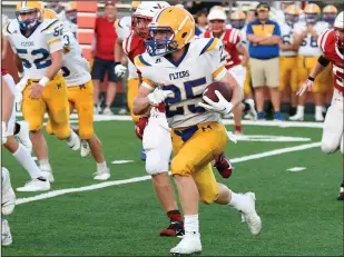  ?? Staff photo/John Zwez and Jason Alig ?? Above: Marion Local’s Kyle Otte looks to bust it around the end Friday night in the Flyers opening game against Wapakoneta. Below: New Bremen’s Kyle Leichliter brings down a Marion ball carrier on Friday night. Left: Flyers’ Peyton Otte looks to throw Friday night.