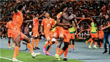  ?? ?? Ivory Coast players celebratin­g during the 2023 AFCON. The team was held to a 2-all draw by Benin on Saturday.