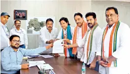  ?? BY ARRANGEMEN­T ?? Congress Secunderab­ad Lok Sabha candidate Danam Nagender files nomination papers in the presence of Chief Minister A. Revanth Reddy in Hyderabad on Wednesday. Khairataba­d DCC (Hyderabad Central) president C. Rohin Reddy is also seen. — Report on Page 3
■