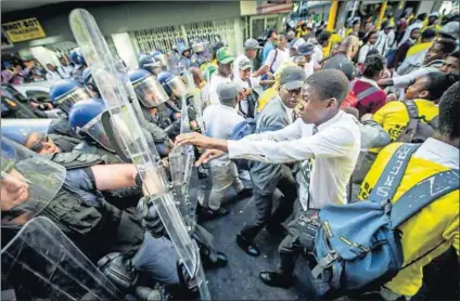  ?? Photo: Conrad Bornman/Gallo Images /Rapport ?? Cracking up: The state of the nation was reflected inside and outside Parliament.