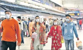  ?? RAJ K RAJ/HT PHOTO ?? Rajiv Chowk Metro station, one of Delhi’s busiest, has been witnessing a thin crowd of commuters ever since the coronaviru­s n outbreak in the city.