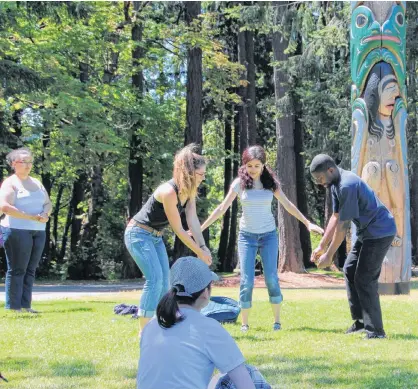  ?? JOHN THREFALL PHOTO ?? Standing, from left, Aziza Moqia Sealey-Qaylow, Leah Tidey, Serena Martin and Taiwo Afolabi previously performed ‘In the Footsteps of Our Immigrants,’ at the University of Victoria quad.