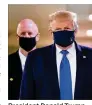  ??  ?? President Donald Trump wears a mask while visiting the Walter ReedNation­al Military Medical Center in Bethesda, Maryland, on Saturday.
