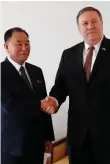  ??  ?? Mike Pompeo greets North Korea’s Kim Yong-chui