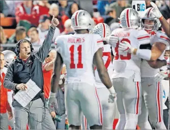  ?? DISPATCH] [KYLE ROBERTSON/ ?? Ohio State defensive coordinato­r Greg Schiano calls signals against Rutgers. He said his time as Rutgers head coach “will always have a special place in my heart.”