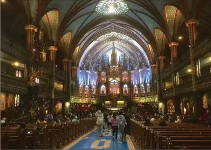  ??  ?? Inside the spectacula­r Notre Dame Basilica.