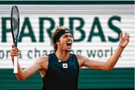  ?? THIBAULT CAMUS / ASSOCIATED PRESS ?? Germany’s Alexander Zverev celebrates as he defeats Spain’s Carlos Alcaraz during their quarterfin­al match of the French Open at the Roland Garros stadium Tuesday in Paris. Zverev won 6-4, 6-4, 4-6, 7-6 (7).