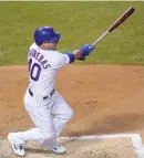  ?? GETTY IMAGES ?? Willson Contreras hits an RBI single to score Anthony Rizzo in the first inning Friday at Wrigley Field.