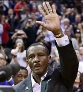  ?? FRANK GUNN — THE CANADIAN PRESS VIA AP ?? Former Raptors coach and current Pistons coach Dwane Casey waves to the crowd during a tribute before the teams’ game Wednesday in Toronto.