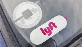  ?? Will Waldron / Times Union ?? While Uber and Lyft drivers often have car signs, the #What’smyname campaign says riders should confirm the car they get into is one they ordered.