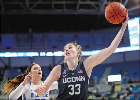  ?? JEFF ROBERSON/AP PHOTO ?? UConn’s Katie Lou Samuelson (33) reaches for a rebound as Saint Louis’ Jordyn Frantz defends during the top-ranked Huskies’ 98-42 victory over the Billikens on Tuesday night in St. Louis.