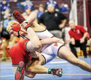  ?? NATE HECKENBERG­ER - FOR DIGITAL FIRST MEDIA ?? Boyertown’s Zak Reckworks to score against Hunter Wright of Clearfield in a 7-4decision at 160 pounds.