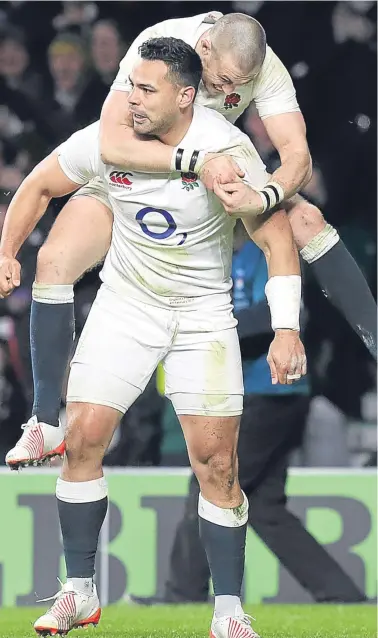  ??  ?? England’s Ben Te’o celebrates scoring his try with team-mate Mike Brown.