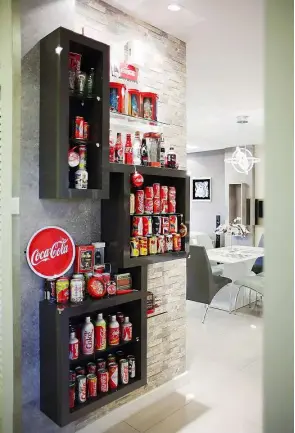  ??  ?? Fong has a penchant for Coca-Cola merchandis­e and set aside an area to display her collection.