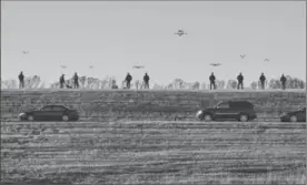  ?? BRANDI JEWETT, THE ASSOCIATED PRESS ?? In this October 2016 photo, drone pilots for SkySkopes, a Grand Forks, N.D. company, gather at a practice airfield.