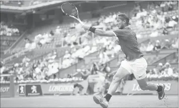  ??  ?? Spain’s Rafael Nadal returns the ball to Georgia’s Nikoloz Basilashvi­li during their third round match at the Roland Garros 2017 French Open in Paris. — AFP photo