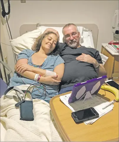  ?? SUBMITTED PHOTO ?? Mary Alicia Sherren and her husband, Bernard French, pass the time watching a movie in the hospital.