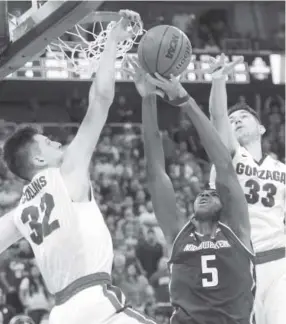  ??  ?? Gonzaga forward Zach Collins, left, was named to the Final Four all-tournament team. Collins, a rim protector, may fall to the Nuggets. Chris Detrick, The Salt Lake Tribune