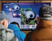  ?? Ahn Young-joon/Associated Press ?? South Koreans watch a TV showing North Korean missiles on parade Thursday as tensions rise in the Korean peninsula.