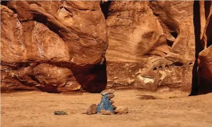  ?? Photograph: Kelsea Dockham/AP ?? Rocks mark the location where a metal monolith once stood in the ground in a remote area of red rock in Spanish Valley, Utah, south of Moab near Canyonland­s national park.