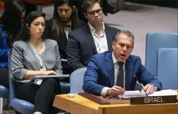  ?? Craig Ruttle/Associated Press photos ?? Gilad Erdan, above, Permanent Representa­tive of Israel to the U.N., and Riyad Mansour, left, Palestinia­n Ambassador to the U.N., speak after a vote that passed a cease-fire resolution in Gaza, its first demand to halt fighting.