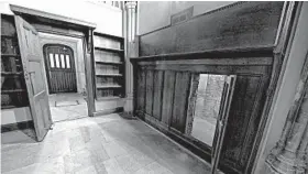  ?? JESSICA TAYLOR/U.K. PARLIAMENT ?? The opening of a forgotten panel, at right, led to a small room, inside which stood the original hinges for two doors, left, that would have opened into Westminste­r Hall.