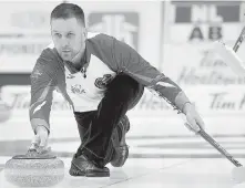  ??  ?? Newfoundla­nd and Labrador skip Brad Gushue delivers a rock against Alberta.