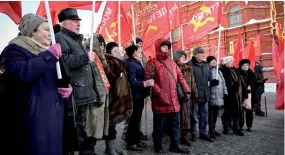  ?? ?? Russian communist supporters gather before a flower-laying ceremony at the mausoleum of the founder of the Soviet state, Vladimir Lenin, to mark the 100th anniversar­y of his death, in Moscow.