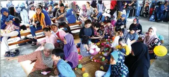  ??  ?? Some of the Sri Satok PDK students enjoy the performanc­es of OKU Day celebratio­n. — Photo by Muhammad Rais Sanusi