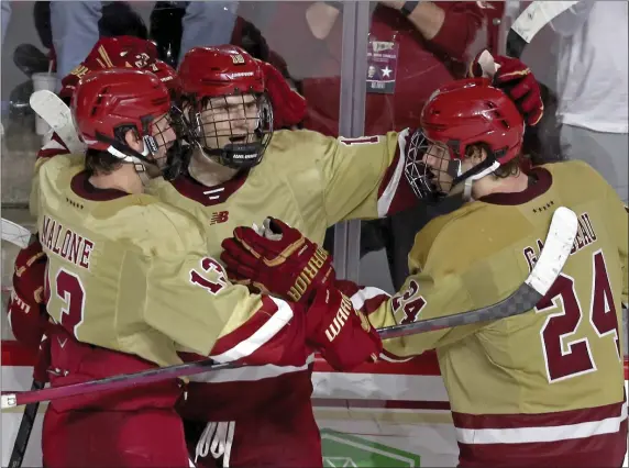  ?? STAFF PHOTO — STUART CAHILL/BOSTON HERALD ?? Boston College forward Cutter Gauthier, middle, celebrates his goal with Jack Malone, left, and Andre Gasseau during BC’s exciting 4-1win over topranked Boston University.