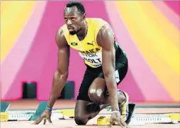  ?? Diego Azubel European Pressphoto Agency ?? USAIN BOLT, readying for his 100-meter heat at the world championsh­ips Friday, is the only athlete to win the 100 and 200 in three consecutiv­e Olympics.