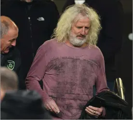  ??  ?? Still a loyal supporter... MickWallac­e making his way to his seat in the Aviva Stadium before Ireland’s clash with Denmark last November.