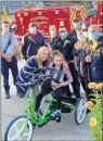  ?? PROJECT FIRE BUDDIES PHOTO ?? Oak Forest-based Project Fire Buddies recently helped acquire an adaptive cycle for Lily Brown, of Oak Forest.