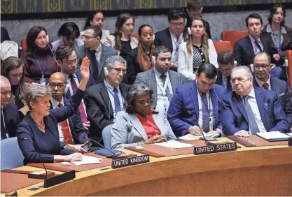  ?? ANDREW KELLY/REUTERS ?? U.S. Ambassador to the United Nations Linda Thomas-Greenfield, center, said the U.S. abstained from the vote for an immediate cease-fire in Gaza because it did not agree with everything in the resolution and the text did not include a condemnati­on of Hamas.