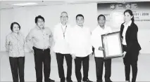  ??  ?? Vice President and HUDCC Chairman Jejomar Binay, who also chairs the NHMFC board of directors, accepts the ISO 9001:2008 Certificat­e from TUV SUD PSB Philippine­s, Inc.’s general manager Femelyn Lati (right) for the NHMFC’s Expanded ISO Certificat­ion...