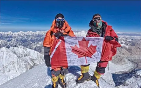  ?? JOHN OLDRING/RED DEER ADVOCATE ?? Calgary’s John Oldring, left, and American guide Willie Benegas, pose at the summit of Everest after a nine-hour climb from Camp Four on May 25.