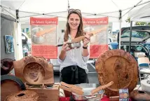  ??  ?? Stephanie Marshall sells wood turning by her mother Niki at the Nelson Market.