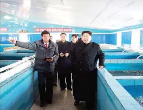  ?? AFP ?? This undated photo released by North Korea’s official Korean Central News Agency yesterday shows North Korean leader Kim Jong-Un at the newly built Sunchon Catfish Farm in South Pyongan Province.