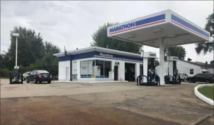  ?? BRIANA CONTRERAS — THE MORNING JOURNAL ?? Gary’s Marathon, 2312 Garfield Blvd., has provided fuel and auto services for the last 13 years. Lorain native Gary Luman, 49, owns and operates Gary’s Marathon. A one-man shop, Luman pumps fuel for his customers and does auto body repairs. He says his business is one of a few gasoline stations in the county that still offers his services.