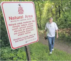  ??  ?? In this June 2013 photo, Windsor environmen­talist Tom Henderson takes a walk through Ojibway Shores.