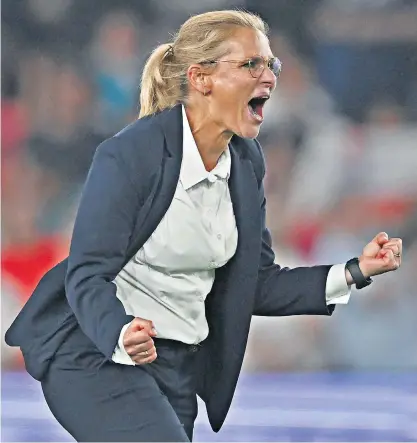  ?? ?? Sarina Wiegman, wearing her M&S suit for the victory over Spain. Sales have soared since, as did those of Gareth Southgate’s waistcoat, inset left, in 2018